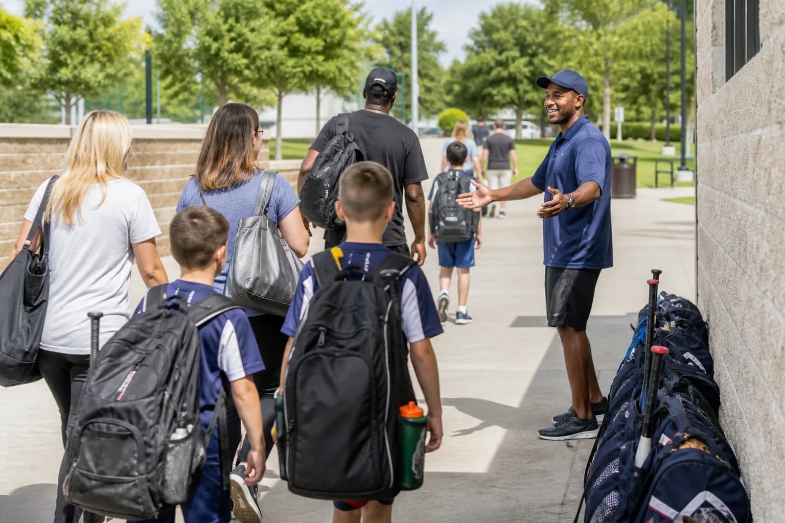 Coach welcoming families and athletes to a tournament