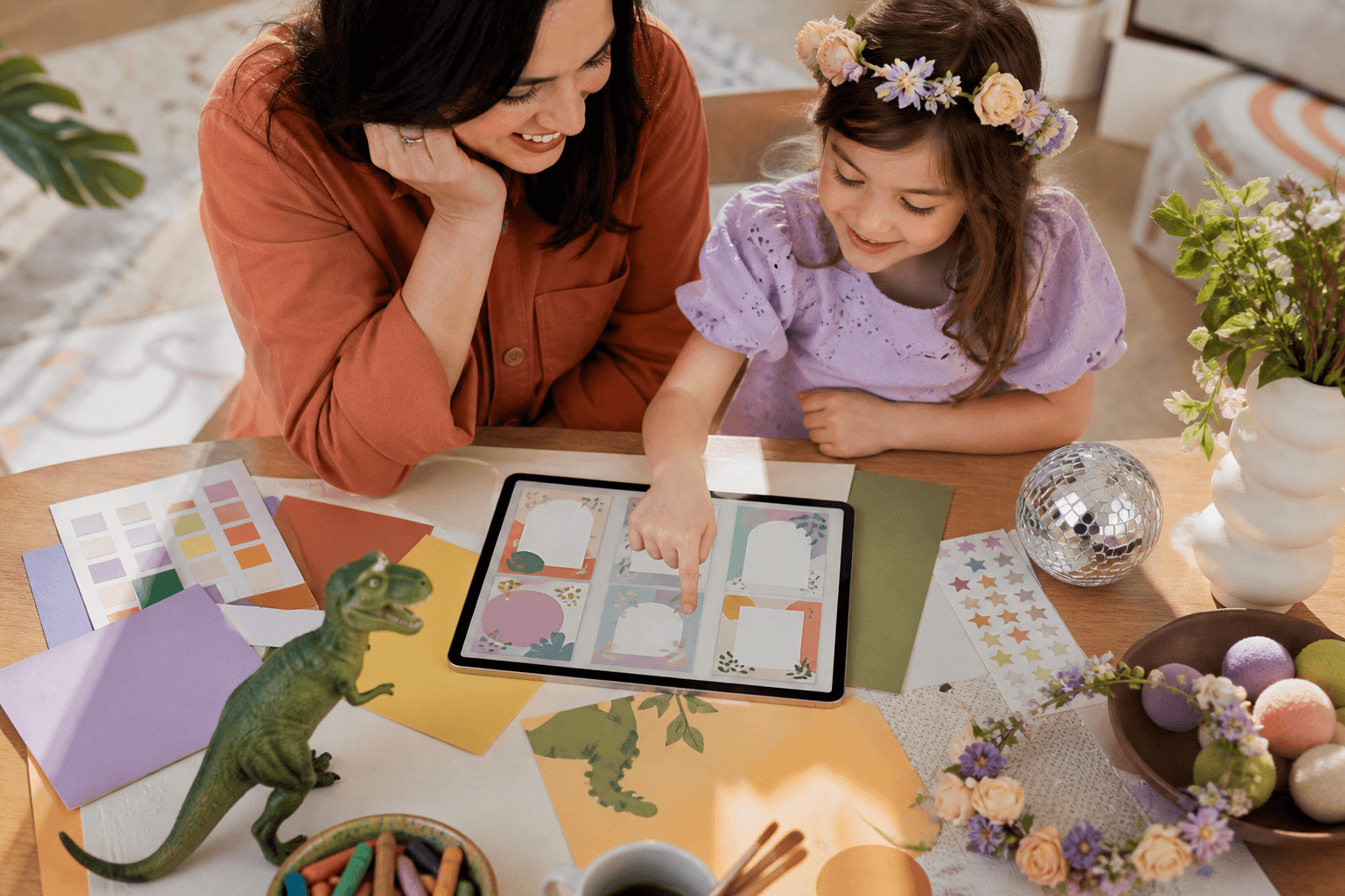 Parent and child choosing a birthday invitation design together